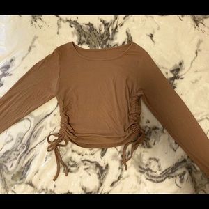brown long sleeved shirt